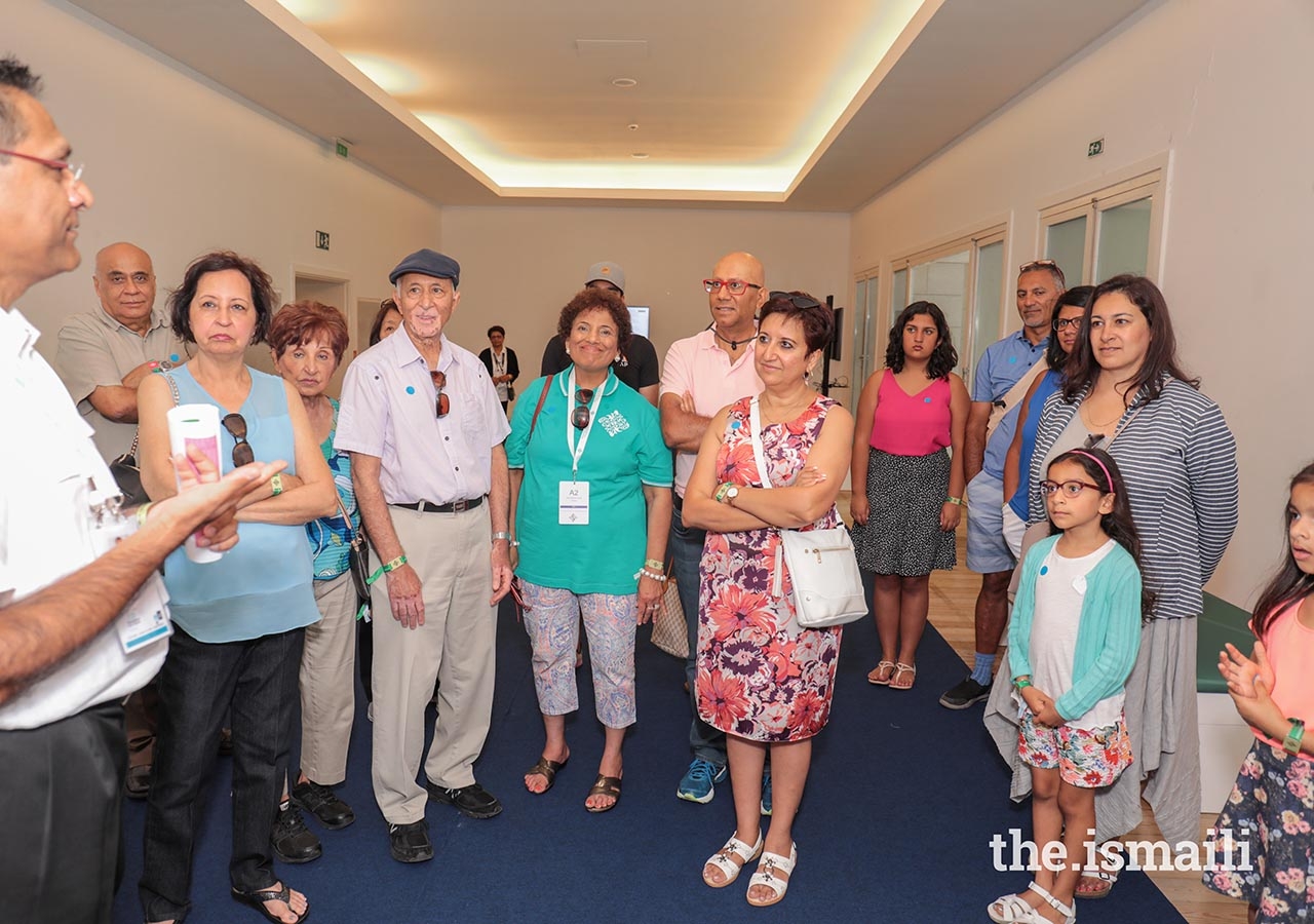 Artists and their family members attend an artists-only viewing of the International Art Gallery.