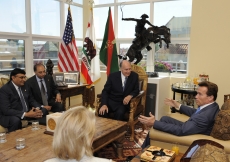 Mawlana Hazar Imam and Governor Arnold Schwarzenegger engaged in discussion at the Governor's Santa Monica office. 