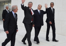 Mawlana Hazar Imam and Prime Minister Harper wave as they walk past the entrance of the Ismaili Centre, together with Luis Montreal, Director General of the Aga Khan Trust for Culture and Malik Talib, President of the Ismaili Council. Zahur Ramji