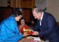 Mawlana Hazar Imam is presented with a gift of a model of a traditional Thai House on the occasion of his Golden Jubilee visit to the Far East. 