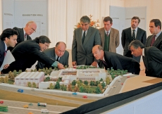 Mawlana Hazar Imam and Prince Amyn carefully examine the model of the Ismaili Centre, Lisbon, as architect Raj Rewal points out certain features of the building.