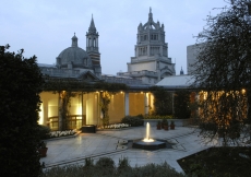 The Roof Garden by night showing the central fountain connected by radial channels to the four corner pools.