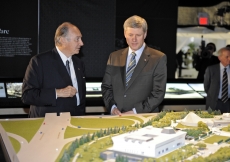 Mawlana Hazar Imam and Prime Minister Stephen Harper in the Exhibition Tent, examining the architectural model.
