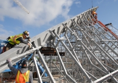 May 2011: Construction workers carefully assemble the frame of the glass roof of the Ismaili Centre, Toronto.