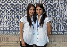 After the Eid celebration winds down, twin volunteers Zuhra and Fatima pose for a photograph at the Ismaili Centre, Dushanbe. The pair regularly help to keep the Centre clean.