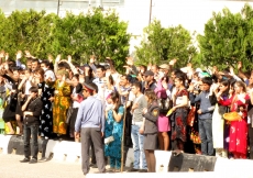 Members of the Jamat wave and greet Mawlana Hazar Imam outside the Ismaili Centre, Dushanbe.