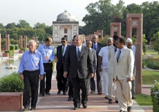 Mawlana Hazar Imam, accompanied by Prince Hussain and officials from the Aga Khan Trust for Culture, walks down the central axis of the Sunder Nursery — once known as Azim Bagh (great garden) — after visiting  the Sunder Burj, a 16th century tomb restored