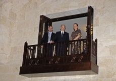Mawlana Hazar Imam together with Prince Rahim and Princess Zahra overlooking the entrance hall of the Ismaili Centre Dubai from the balcony above. 