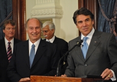 Governor Rick Perry of Texas addressing the media prior to the signing of the Memorandum of Understanding between the University of Texas and the Aga Khan University, as Mawlana Hazar Imam looks on.   