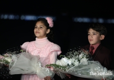 Young children waiting to present bouquets to Mawlana Hazar Imam