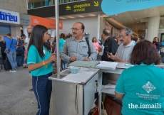 Jamati members check in with volunteers at the Lisbon Airport.