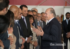Mawlana Hazar Imam shares a light moment with Jamati leaders upon arrival in Vancouver.