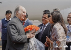 President of the Ismaili Council for Western India Aslam Lilani and his wife welcome Mawlana Hazar Imam with a bouquet of flowers upon his arrival in Mumbai.