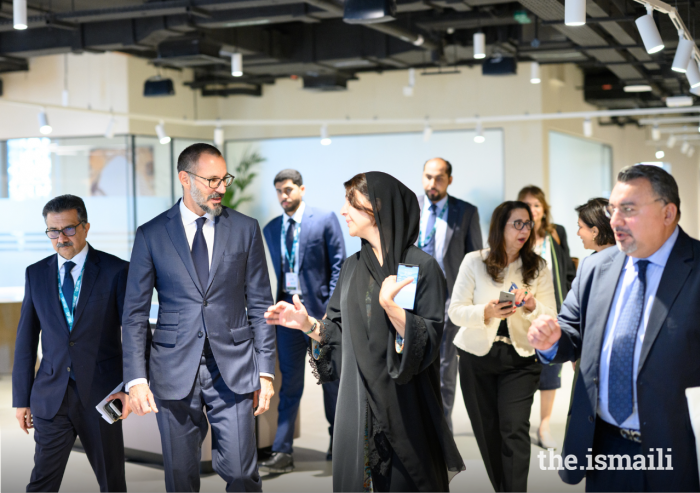 Prince Rahim in conversation with Her Excellency Reem Ebrahim Al Hashimy, the UAE Minister for International Cooperation, at the 28th UN Climate Conference held in Dubai.