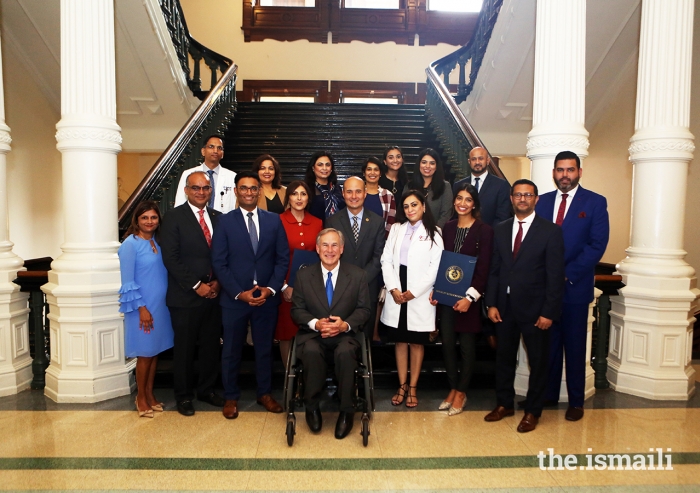 Texas Governor Greg Abbott poses with members of the Ismaili Council for the Southwestern US and a number of Ismaili volunteers at the Texas State Capitol on 26 May 2021. 
