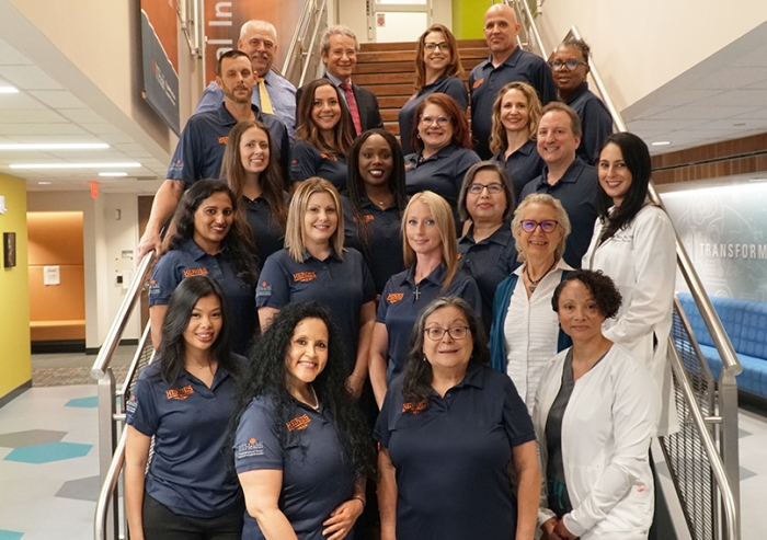 Team of Center for Health Systems Analytics at UTHealth Houston. The Heroes Helpline is one of the projects managed by the Center.