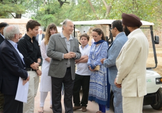 Mawlana Hazar Imam speaking with AKTC staff in 2015 after touring the Sundar Nursery and Batashewala complex with Prince Aly Muhammad, Princess Zahra and her children, Sara and Iliyan.