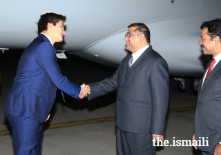 Prince Aly Muhammad is greeted by Hafiz Sherali, President of the Ismaili Council for Pakistan, at Islamabad Airport.