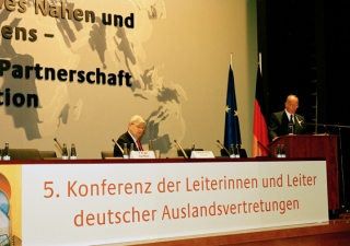 Mawlana Hazar Imam speaking at the German Ambassadors conference, with Joschka Fischer, German Minister for Foreign Affairs, looking on.