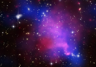 A composite of three separate images of the same galaxy cluster collision in one image.