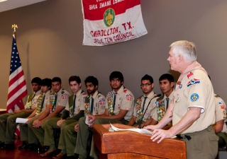 The keynote speaker, Congressman Pete Sessions, addresses the audience about the importance of scouting and community service.