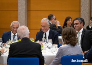 President Marcelo Rebelo de Sousa, Nazim Ahmad, Diplomatic Representative of the Ismaili Imamat to Portugal (left), and Rahim Firozali, President of the Ismaili Council for Portugal (right), enjoy a light moment at the Ismaili Centre, Lisbon.