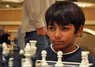 Danial Asaria plays an intense game at a national US chess championship.