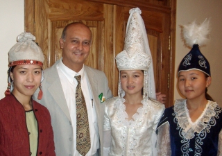 Nasir Jetha with traditional dancers in Kyrgyzstan, where he served as a TKN volunteer at the University of Central Asia.