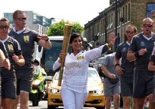Zahra Jessa runs as a torch bearer in the 2012 London Olympics on 25 July.