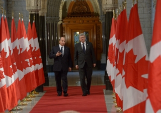 Mawlana Hazar Imam and Prime Minister Stephen Harper walk the Hall of Honour at the Parliament of Canada.