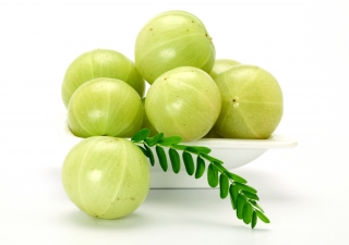 Amla (Indian gooseberry) is a tangy seasonal fruit that is high in vitamin C.