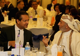 Ismaili Council for the UK President Amin Mawji breaks bread with Yemeni Ambassador, His Excellency Abdulla Ali Al-Radhi at an Iftar dinner hosted at the West London Jamatkhana on 21 July 2014.