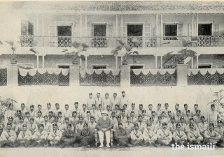 Mawlana Sultan Mahomed Shah in his IVC Colonel uniform surrounded by members of the IVC in India.