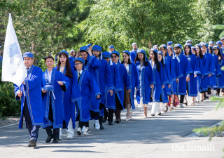 The student procession makes their way towards the graduation hall at UCA’s Naryn campus.