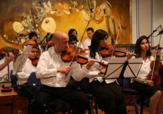 Members of the Royal Philharmonic Orchestra perform with the Ismaili Community Ensemble. 