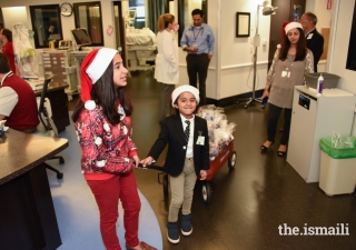 Maya and Tabish Tharoo doing their Christmas rounds at Winnie Palmer Hospital, Miami.