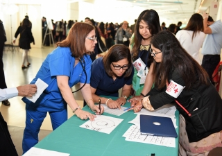 Members of the medical team were among the thousands of volunteers who cared for the Jamat during the July 11 celebration at the Kay Bailey Hutchison Convention Center in Dallas.