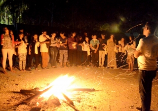 Global Encounters campers gather around a bonfire in Zanzibar. Saraan Jiwani
