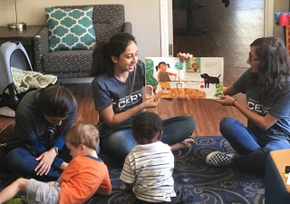 From Left: Lubna Chatoor, Zehra Hooda, and Karishma Malik enjoy a moment reading with children at Alpha House, a Tampa, FL homeless shelter.