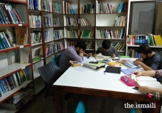 Young students study in the Gulshan-e-Noor Library and Reading Room.