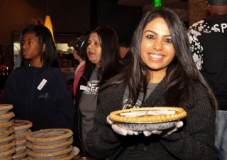 An Ismaili volunteer prepares Thanksgiving pumpkin pie as part of Operation Turkey to deliver meals for people in need in Dallas. Sara Maherali