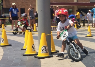 Pasha rounds a corner during a 2017 Strider Cup race on his balance bike. The Strider Cup is an international competition for children ages 2-5.
