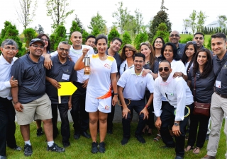 Aga Khan Park volunteers gather with Leila Keshavjee, who carried the Pan Am flame. Ismaili Council for Canada