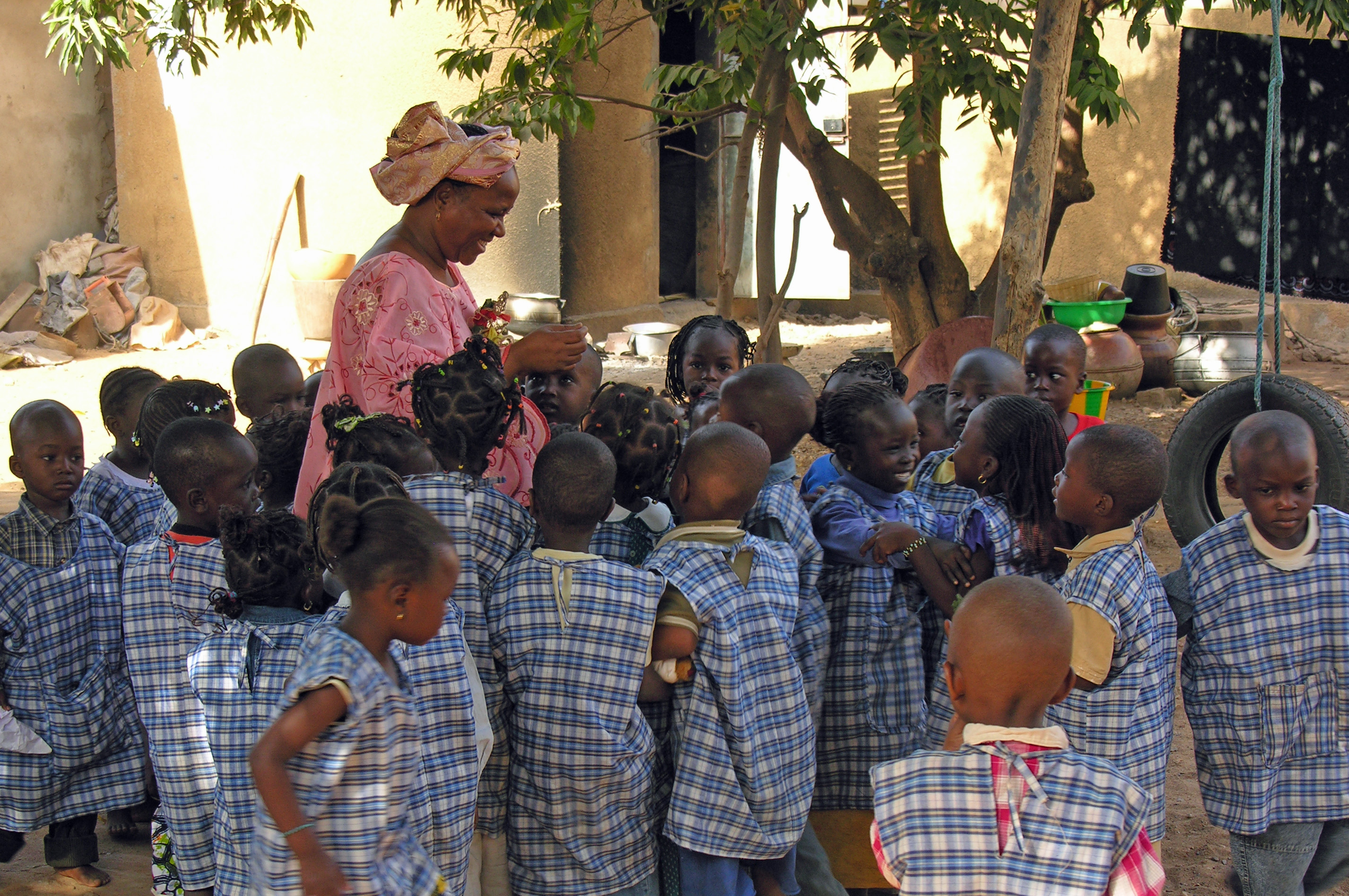 Children from a kindergarten in Bamako gather around their teacher. Early Childhood Development is an important focus of the Aga Khan Foundation, as part of their commitment to providing better early caring and learning environments for young children. Photo: Courtesy of AKDN