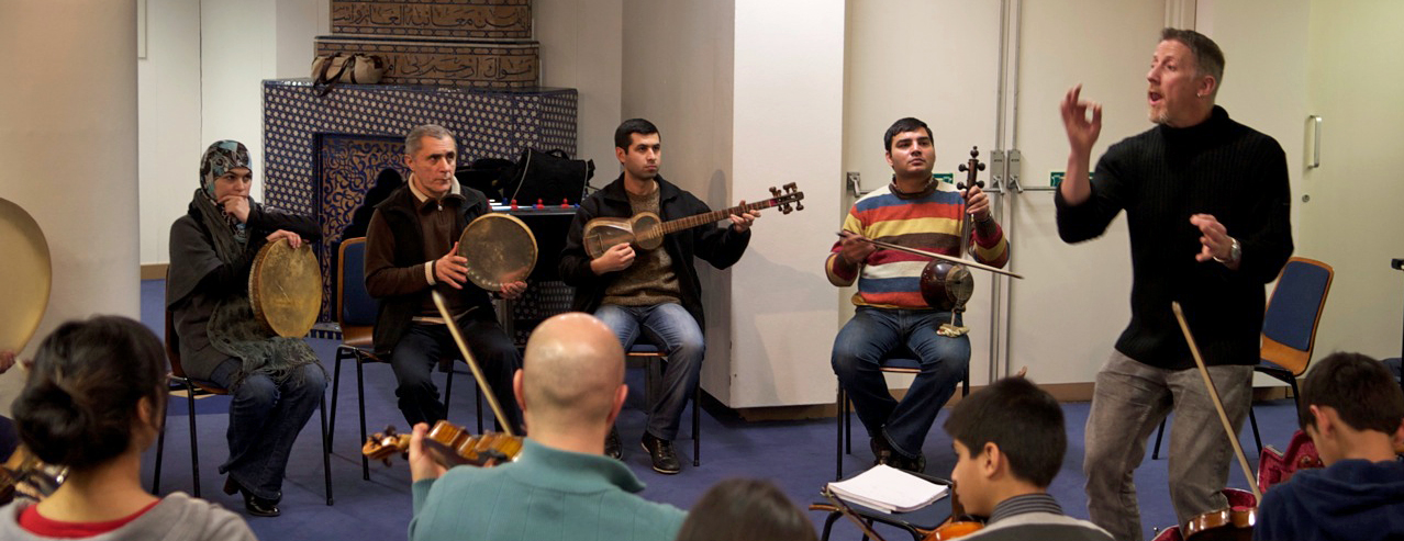 Paul Griffiths making music with the Alim Qasimov Ensemble and the Ismaili Community Ensemble. Photo: Naveed Osman