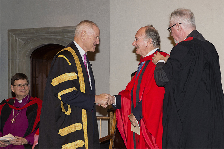 Chancellor Graham confers the honorary degree upon Mawlana Hazar Imam, as Professor Andy Orchard, former Provost of Trinity College, performs the hooding. Photo: Moez Visram